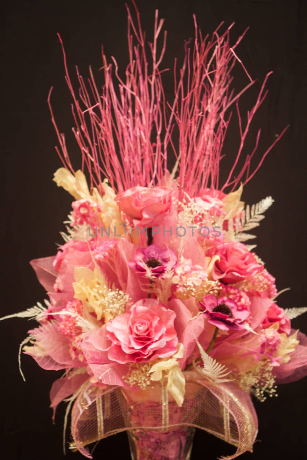 Imitation bouquet of beautiful flower on black background, stock photo