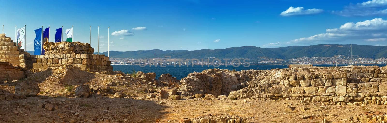 Nesebar, Bulgaria - August 30, 2013: Ancient ruins and the remains of an old fortress wall in the old town of Nessebar, on the Black Sea coast. UNESCO world heritage site. Panoramic shot.