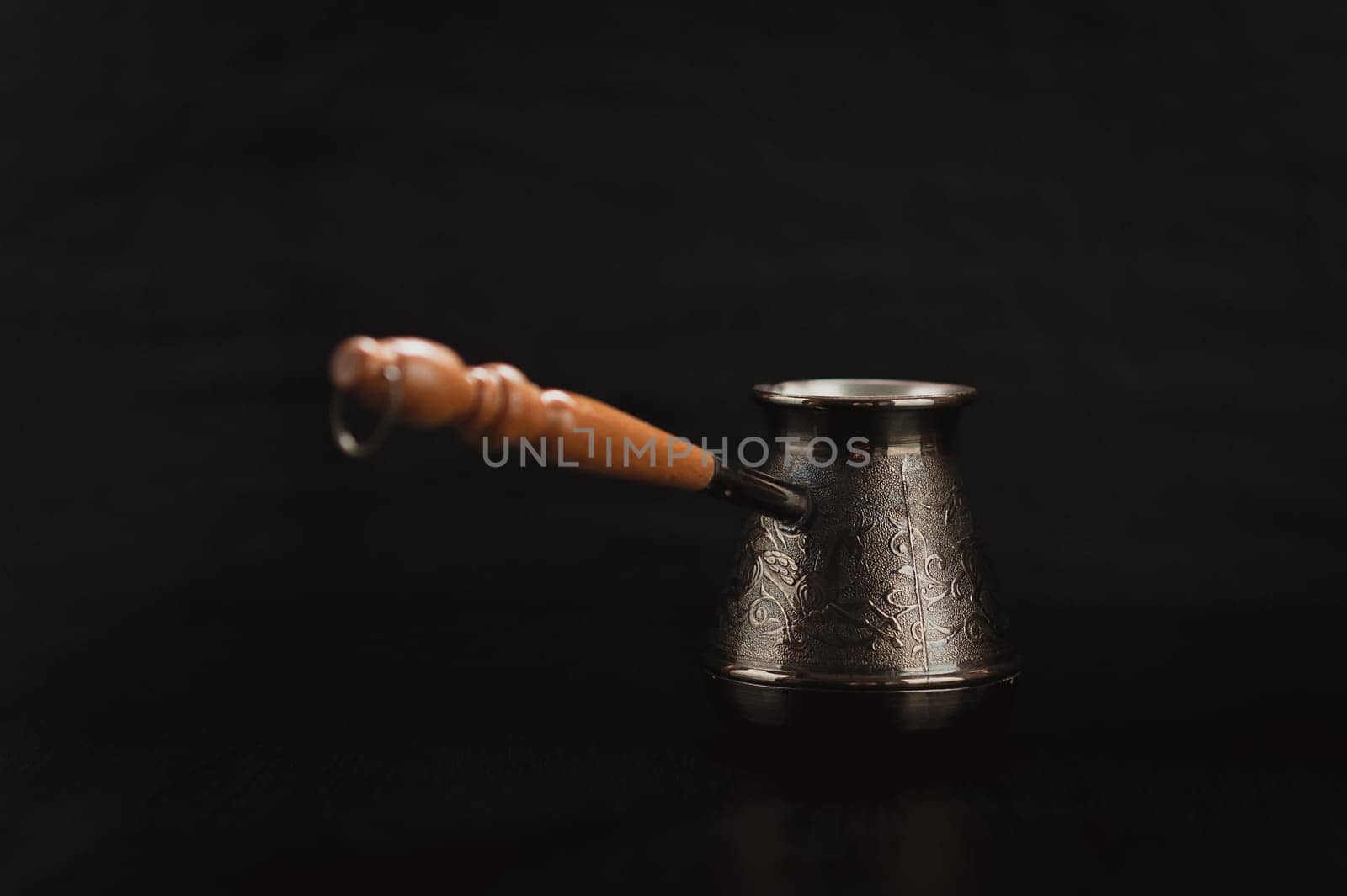black coffee, coffee beans, instant fast on a black background, with the Turks for brewing coffee and the glass jar of instant coffee quickly
