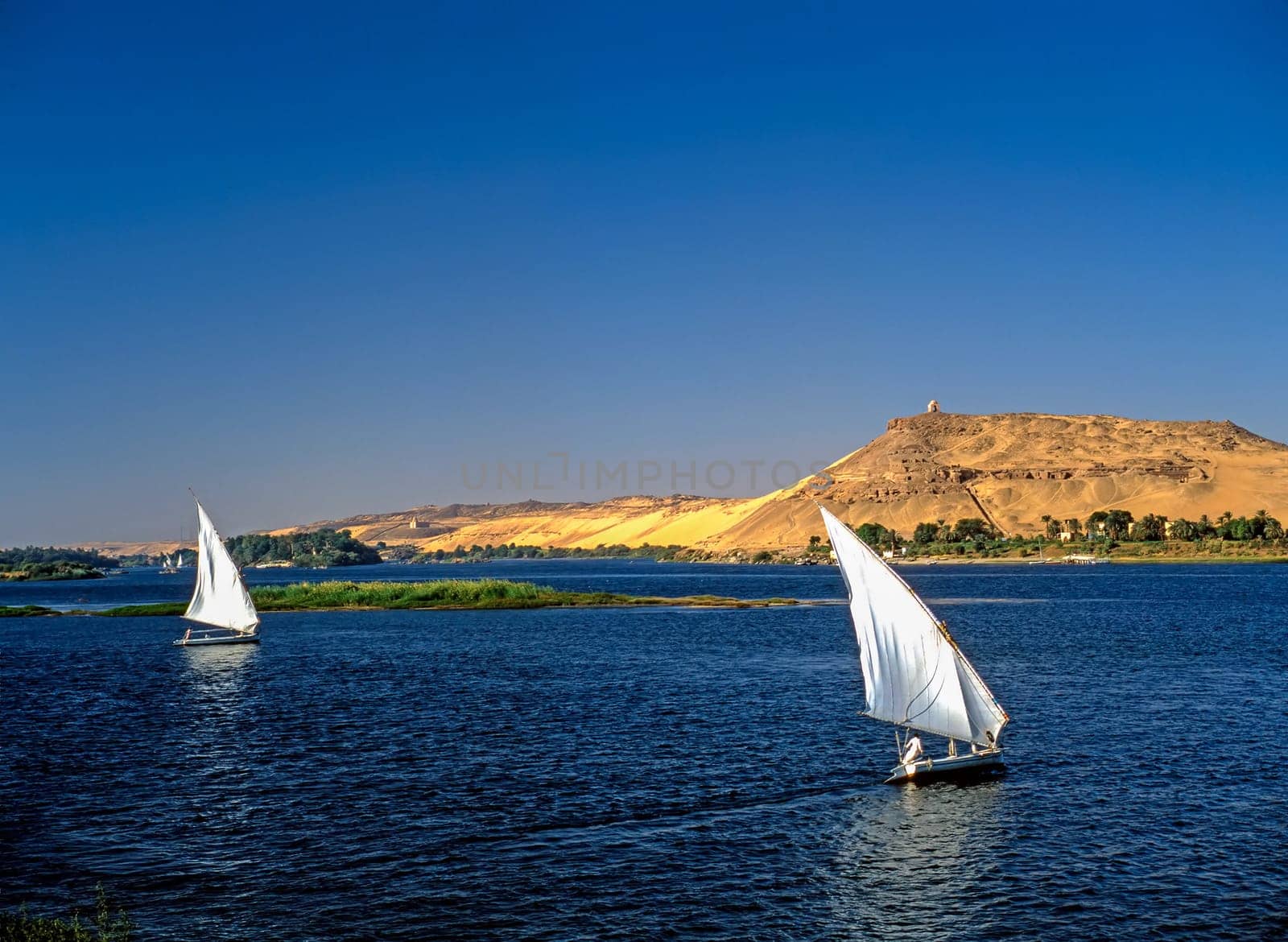 River Nile with feluccas in background monument  to  Aga Khan