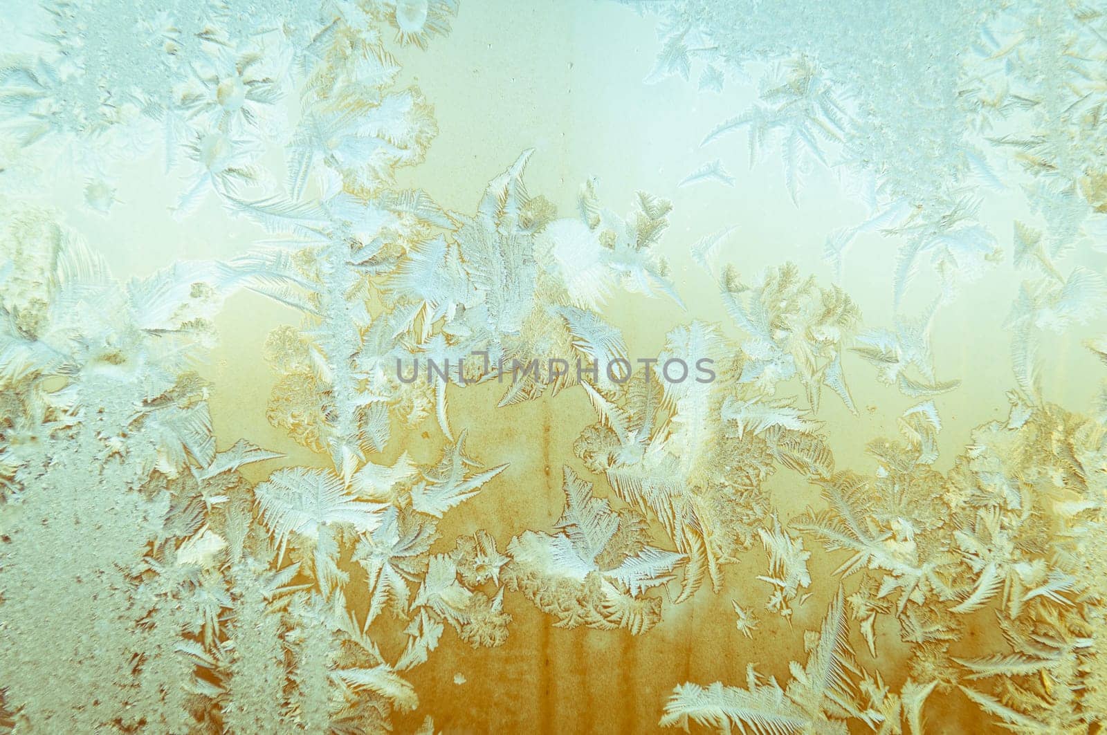 Beautiful frosty glass frostwork and ice flowers on window glass