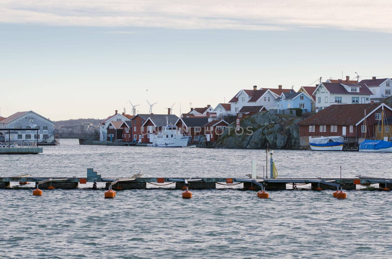 one harbour in sweden on the westcoast a fishingboat and many other boat