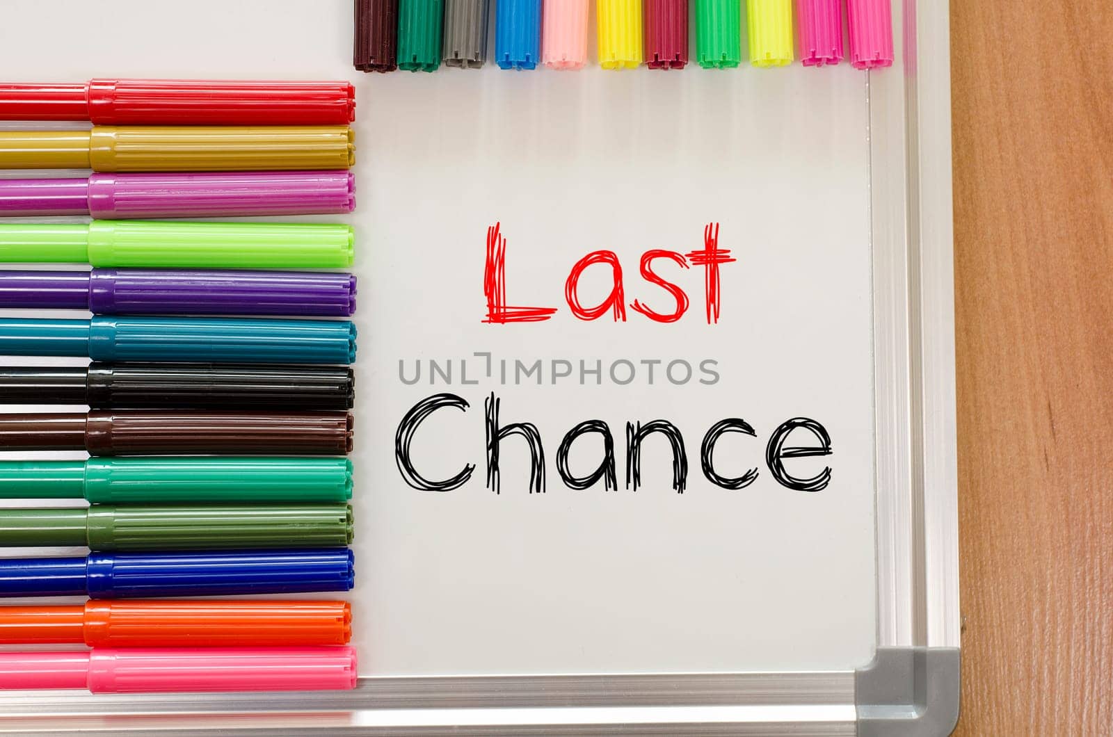Felt-tip pen and whiteboard on a wooden background and text concept