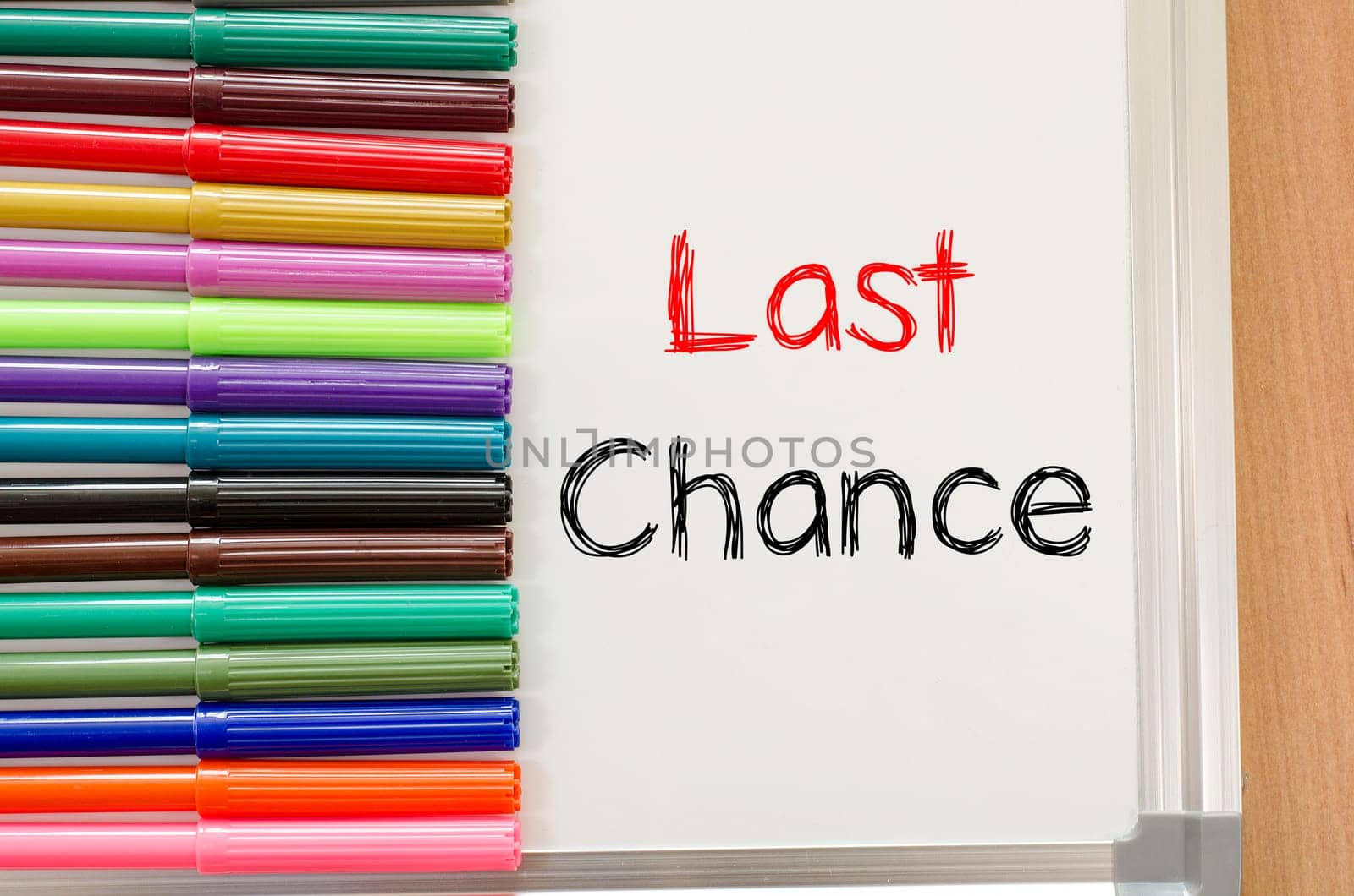 Felt-tip pen and whiteboard on a wooden background and text concept