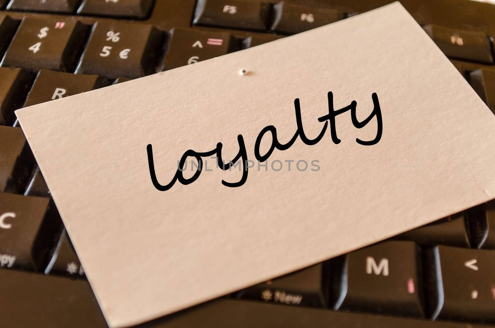 Loyalty text concept over keyboard background