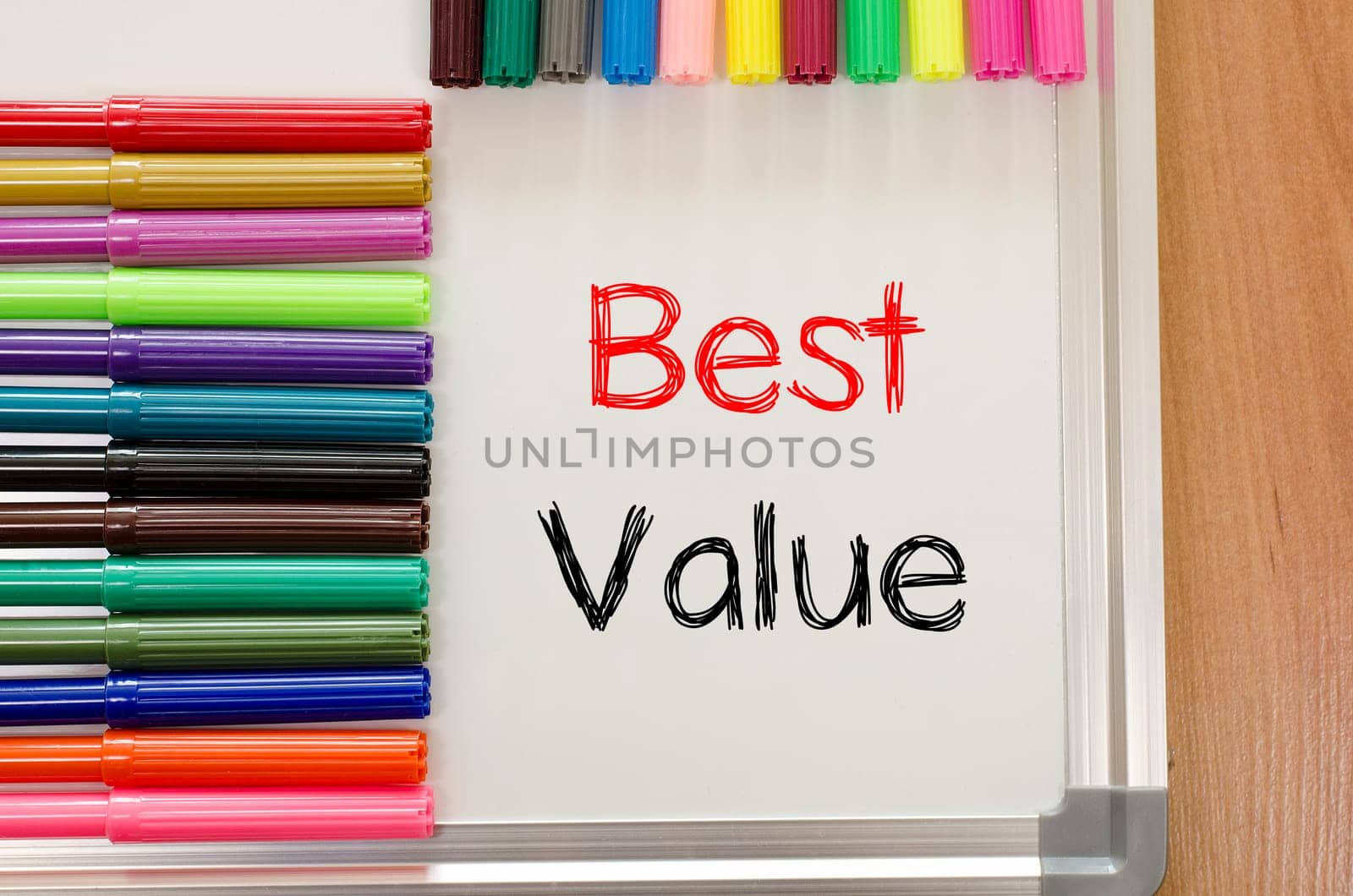 Felt-tip pen and whiteboard on a wooden background and text concept