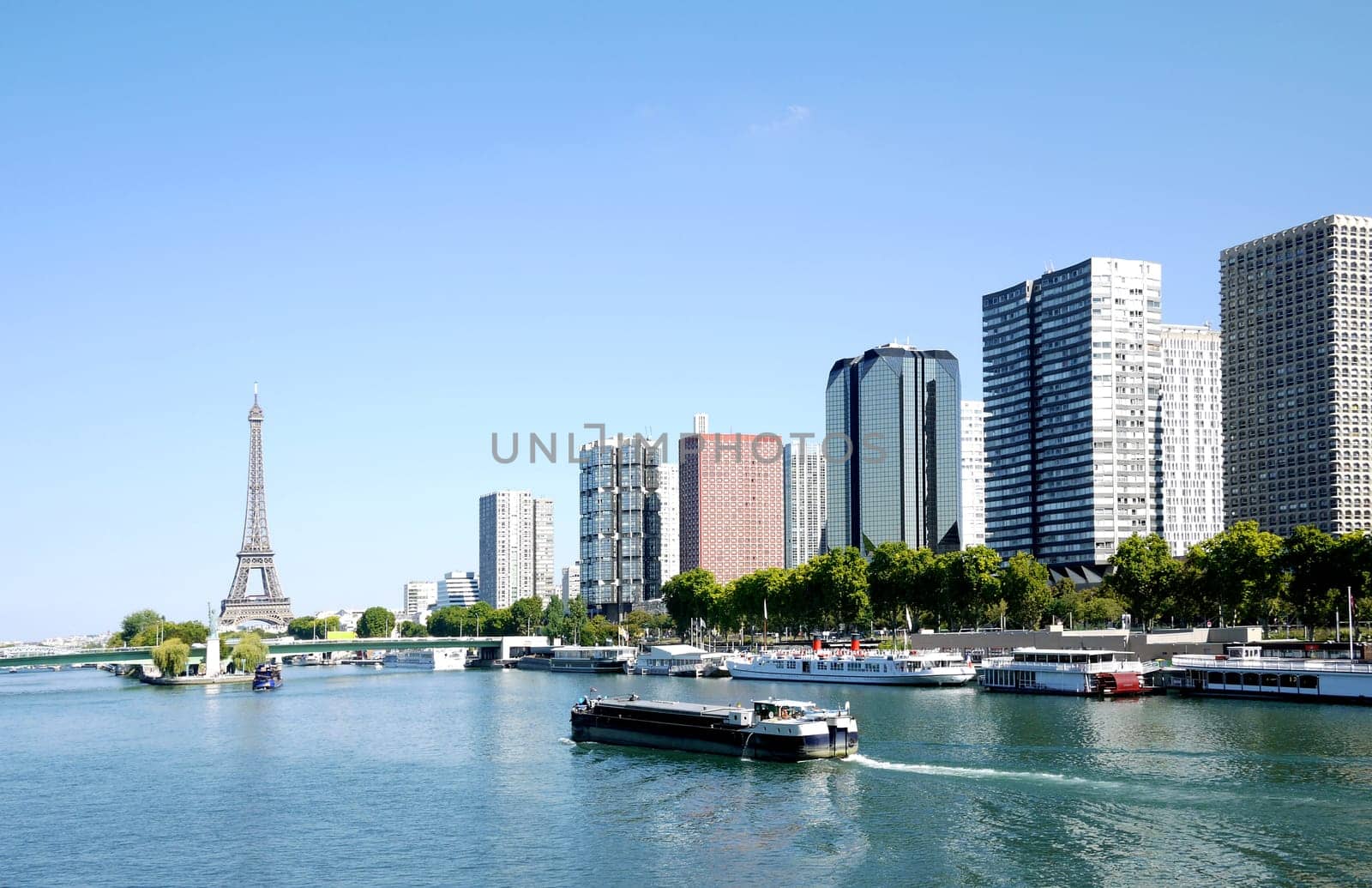 barge on the Seine and Eiffel tower, Paris, France