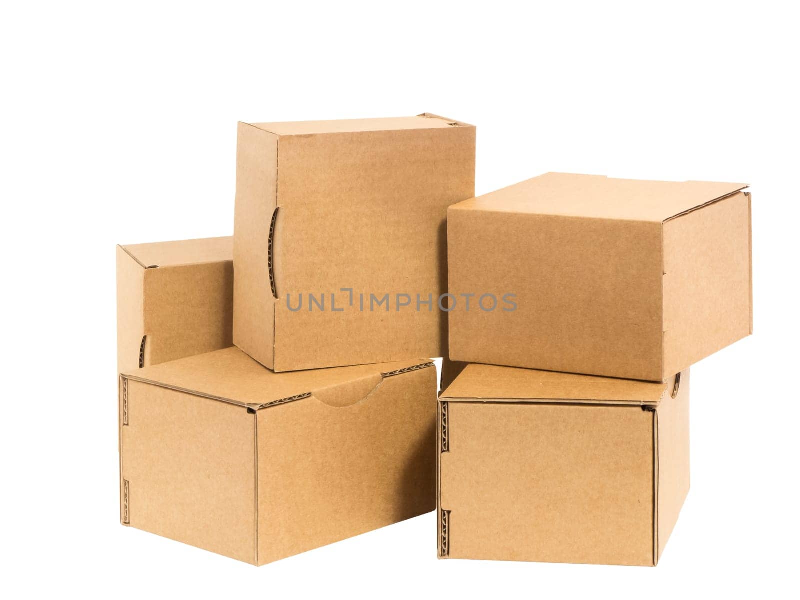 Five irregularly stacked small brown cardboard boxes insulated on white.
