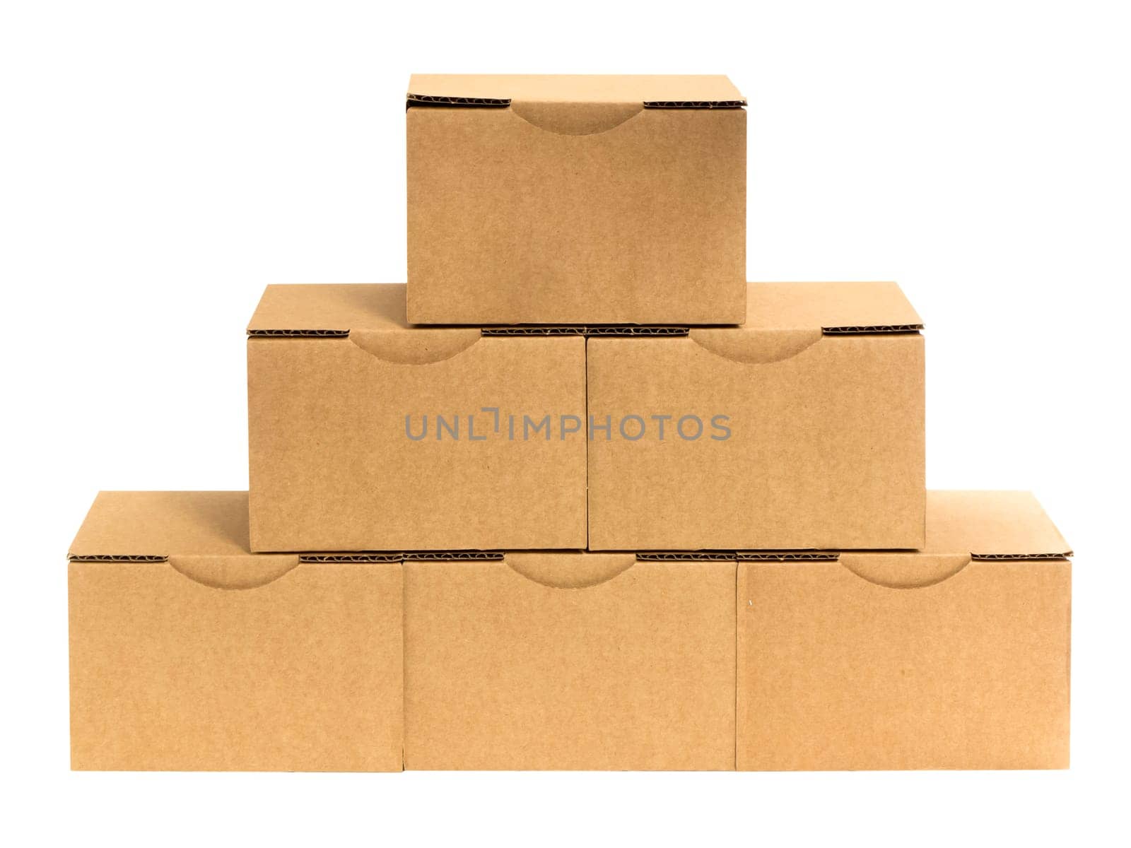 Six stacked small brown cardboard boxes insulated on white.