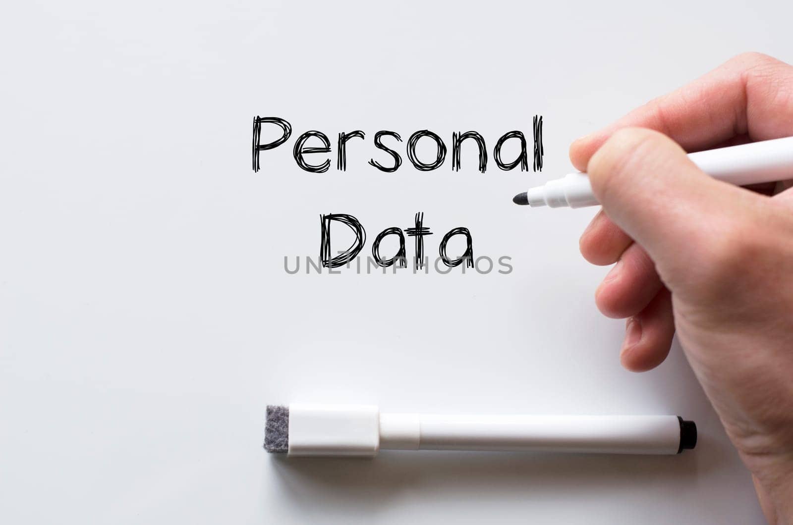 Human hand writing personal data on whiteboard