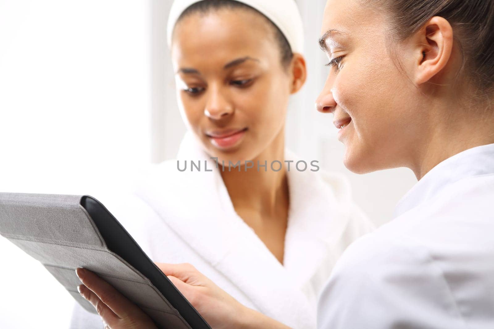 beauty advice,woman in beauty salon. cosmetic consultancy,direct sales. beauty portal,advice in the office beautician advises clients of the appropriate cosmetic skin type