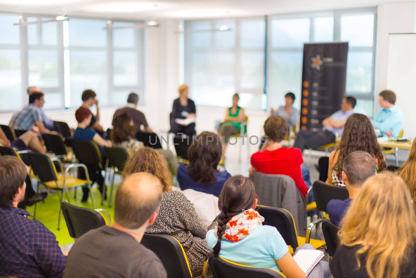 Round table discussion at Business convention and Presentation. Audience at the conference hall.