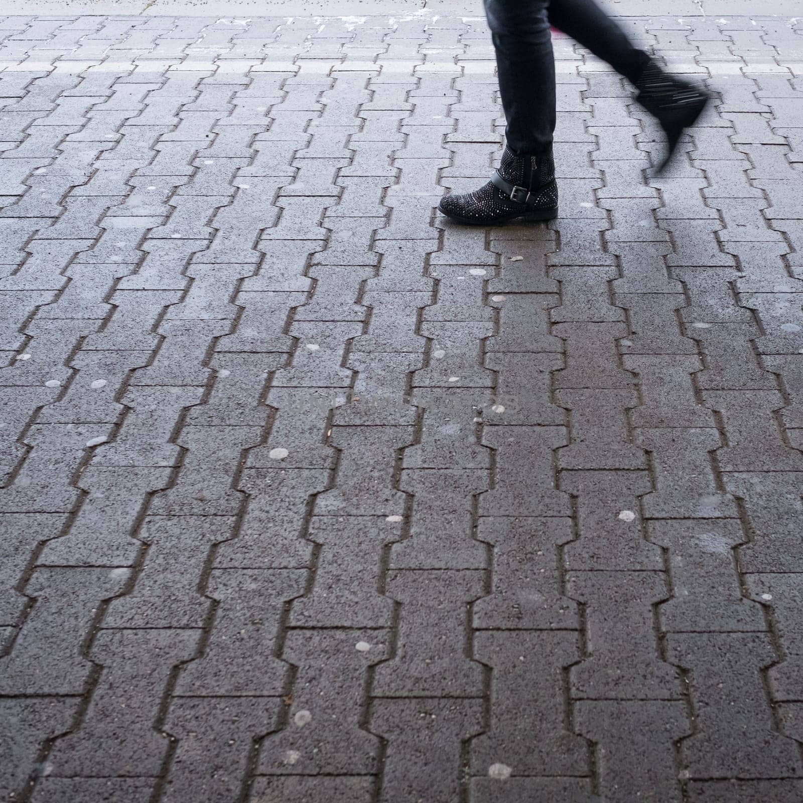 Legs of a woman on the platform with motion blur