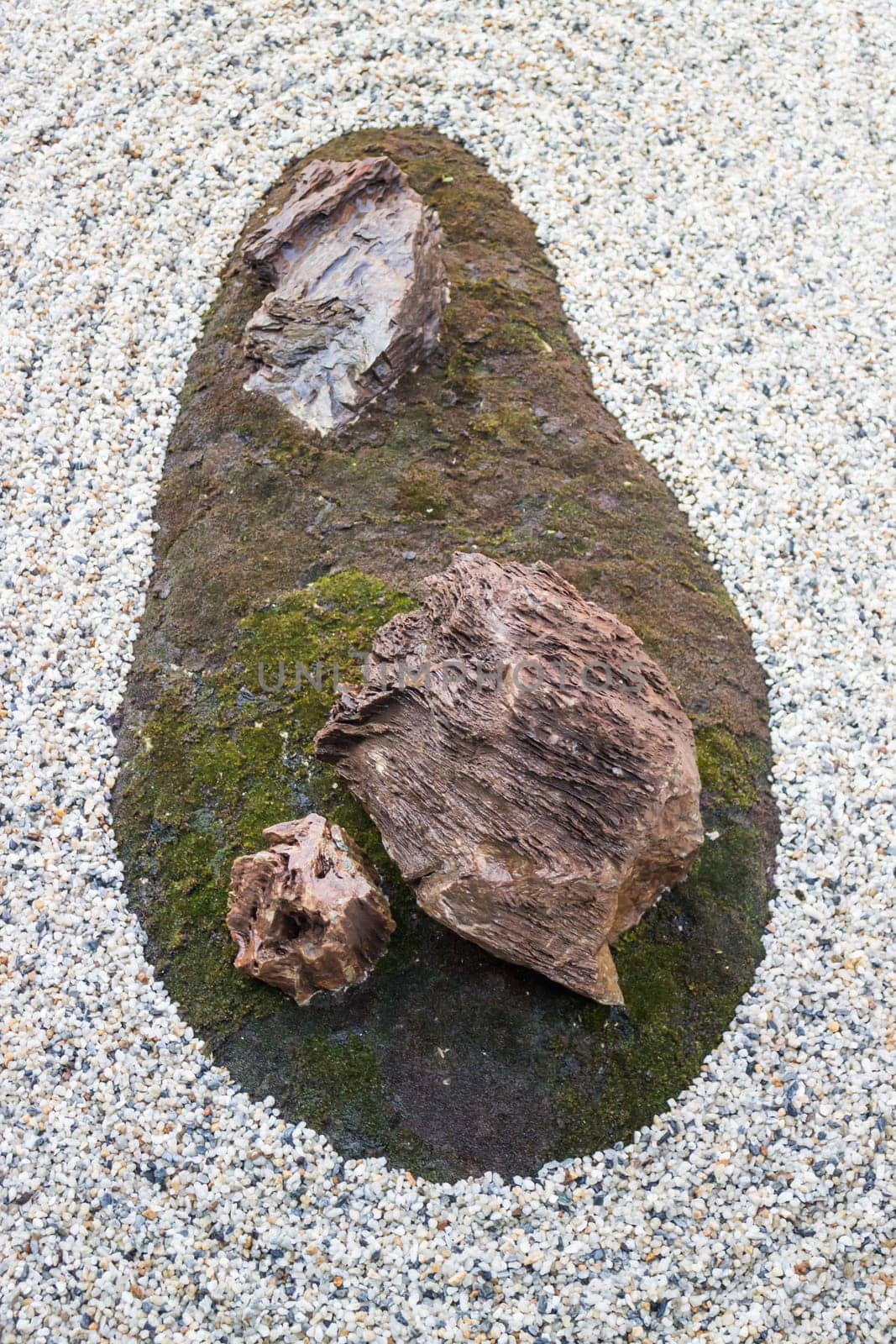 Zen gardens typically contain gravel and bare stones, stock photo