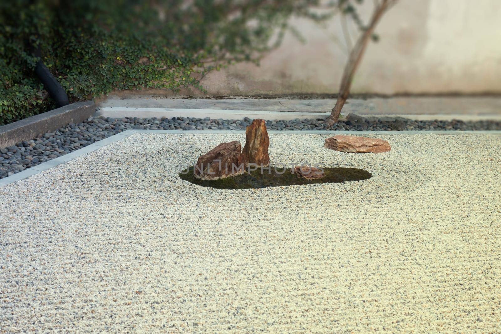 Zen gardens typically contain gravel and bare stones, stock photo