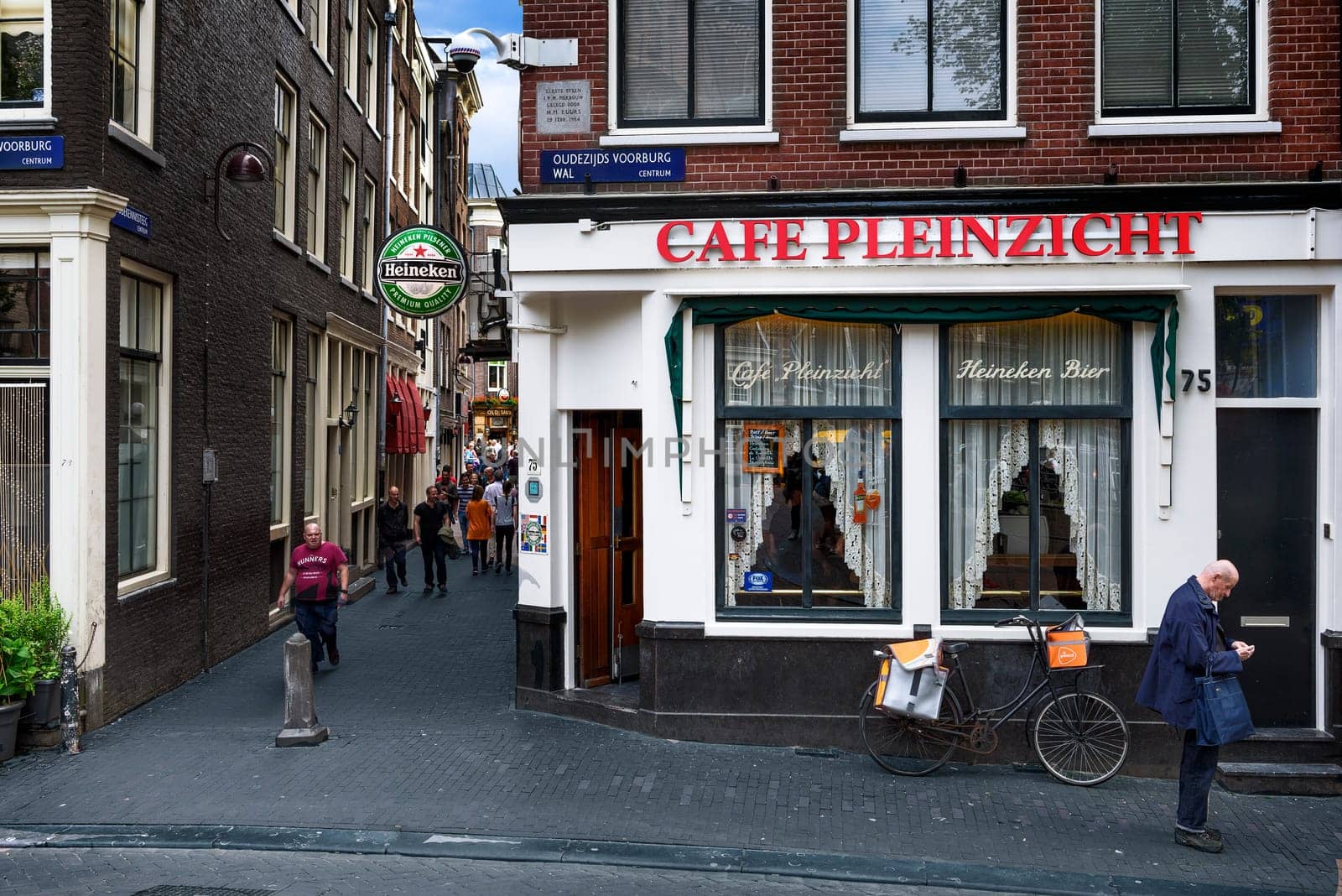 AMSTERDAM, NETHERLANDS - JULY 7, 2016: Typical street iand traditional cafe near Oostelijk Havengebied  - special neighbourhood is full with vintage and designer shopping, speciality stores and cozy cafes, Amsterdam.