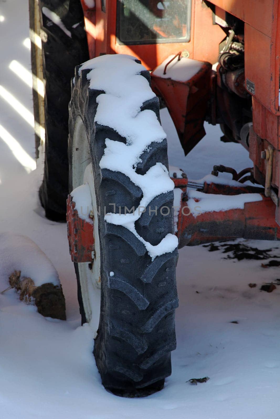 Tyres on a red tractor in winter
