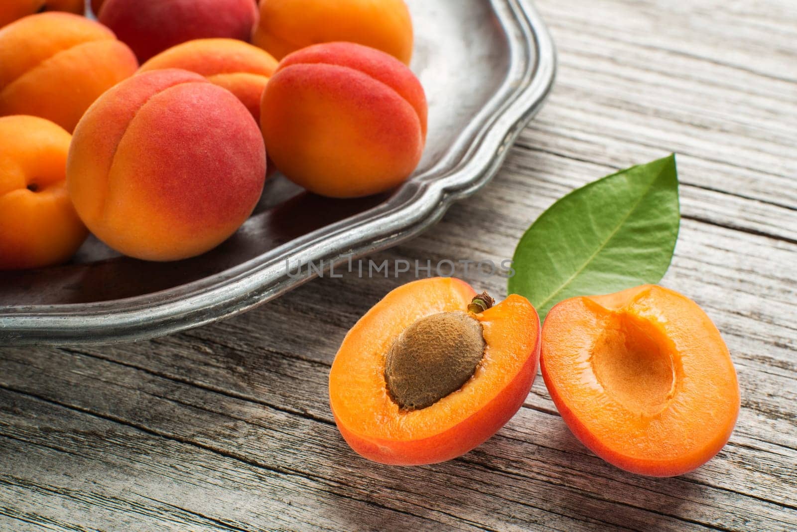 Fresh Apricots on wooden table close up
