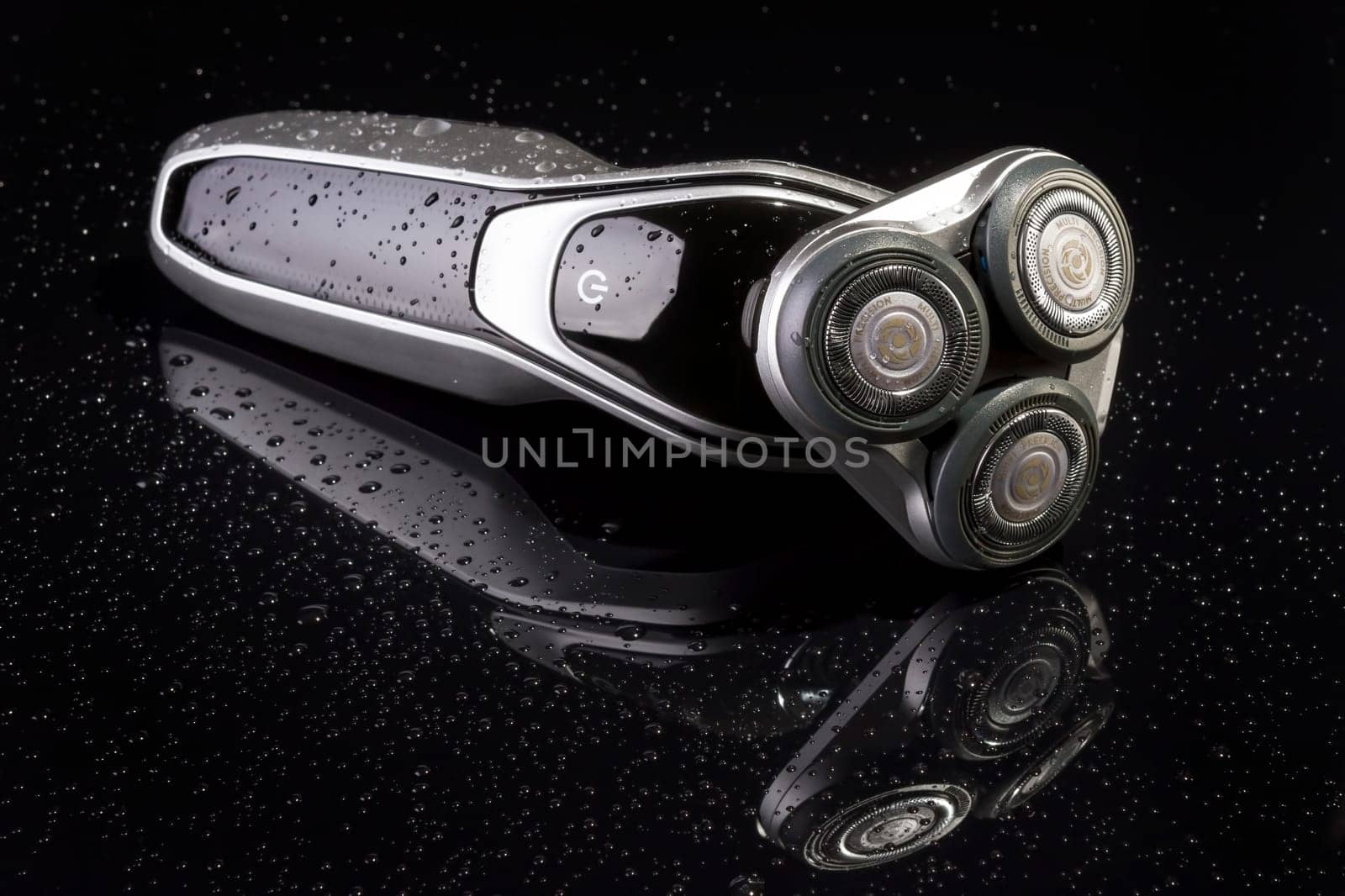 Electric shaver closeup on black background. Multi Precision text written on razor head! Best precision for shave!
