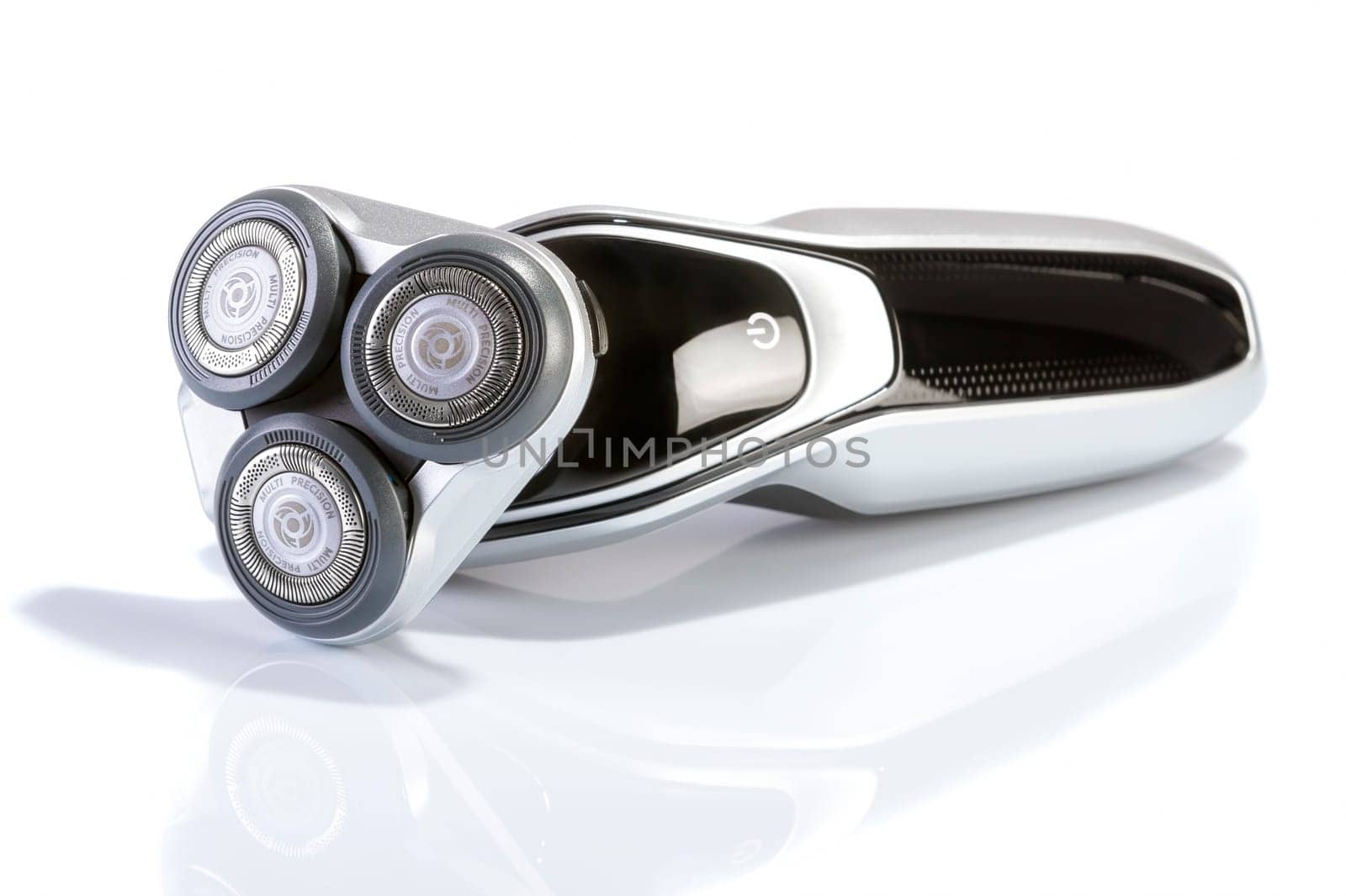 Electric shaver closeup on white background. Multi Precision text written on razor head! Best precision for shave!