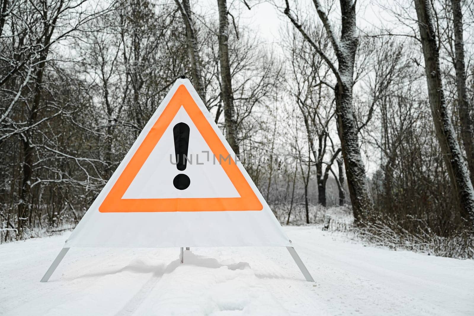 Sign with exclamation mark in the forest