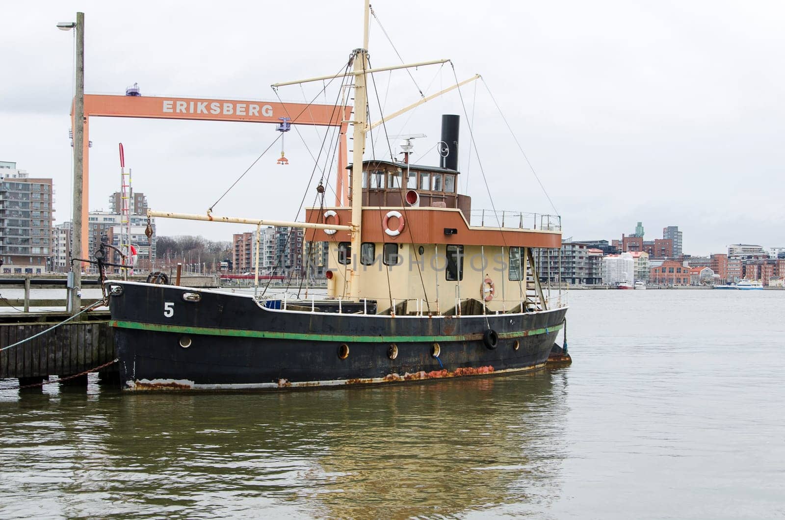 one old boat on the pier in the harbour in Gothenburg