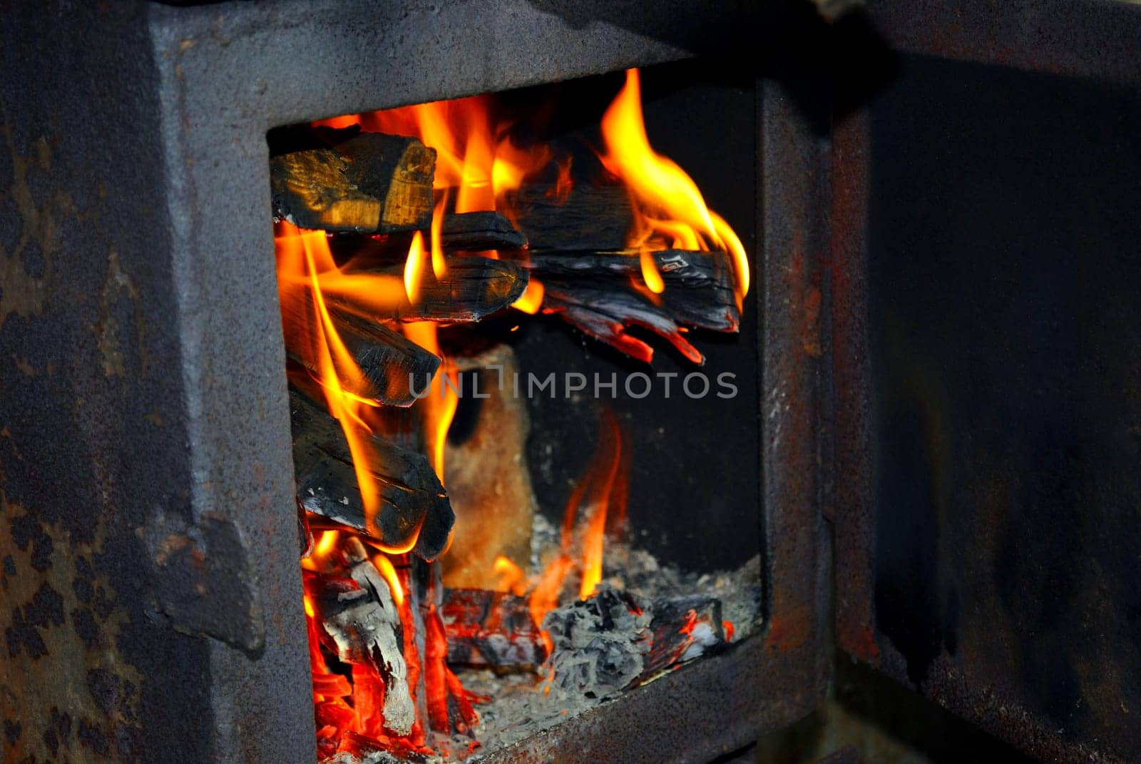 Burning fire wood in the brick furnace