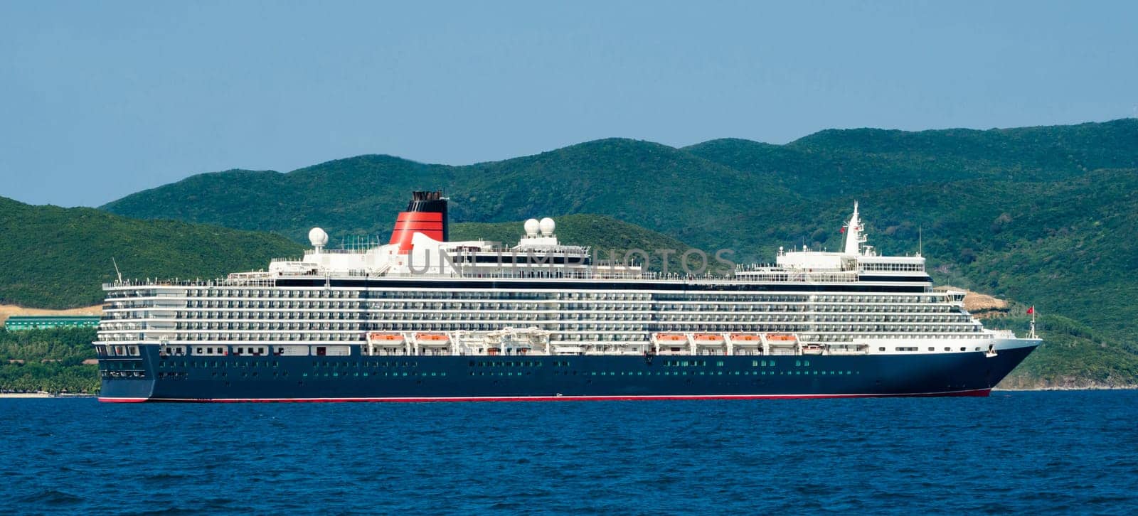 A large cruise ship enters the port