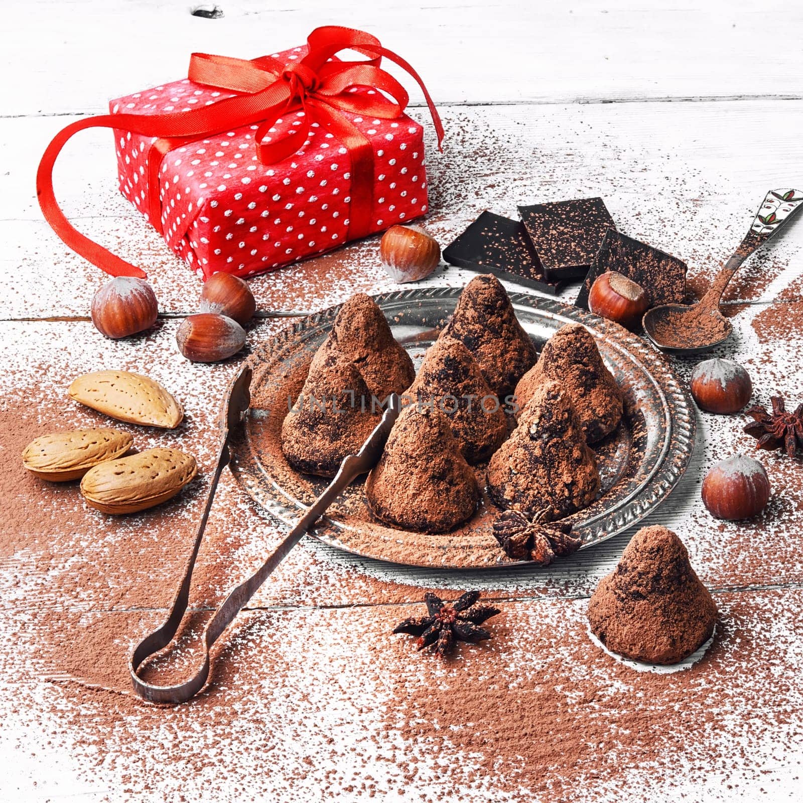 Chocolate truffles candies with cocoa powder and nuts