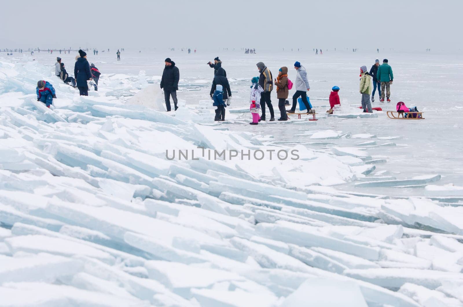 People walking and ice skating on the frozen Balaton Lake at Sifok, Hungary on 29th January, 2017