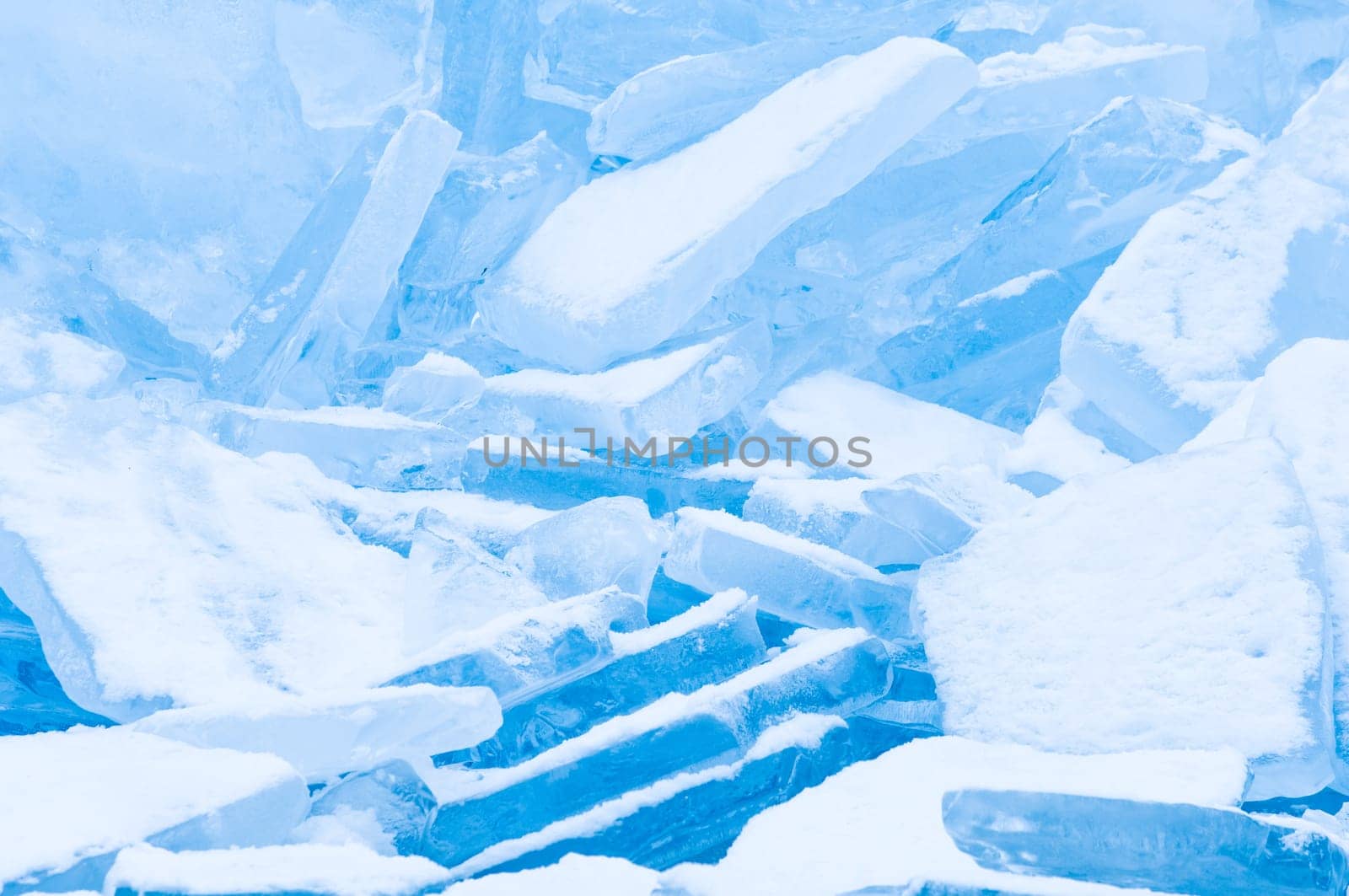 Winter scene at a frozen lake with ice-pack and other ice formations