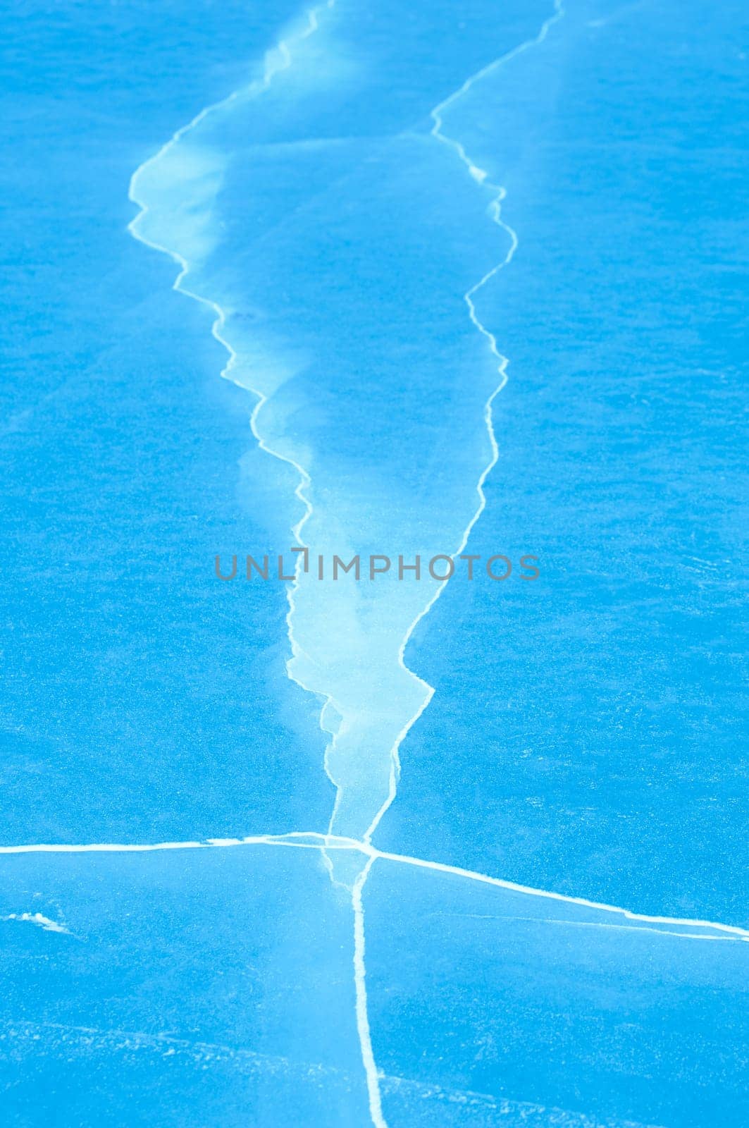 Winter scene at a frozen lake with ice-pack and other ice formations