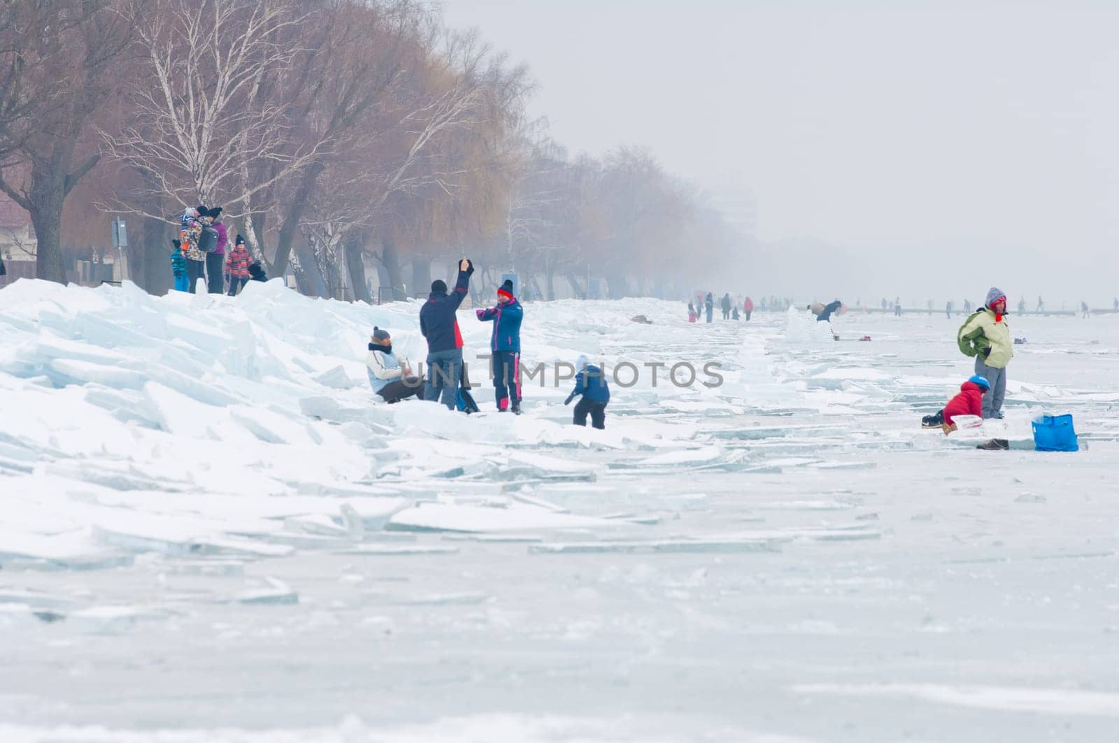 People walking and ice skating on the frozen Balaton Lake at Sifok, Hungary on 29th January, 2017