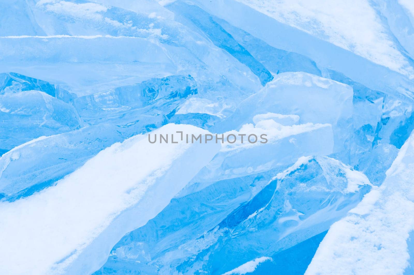 Winter scene at a frozen lake with ice-pack and other ice formations
