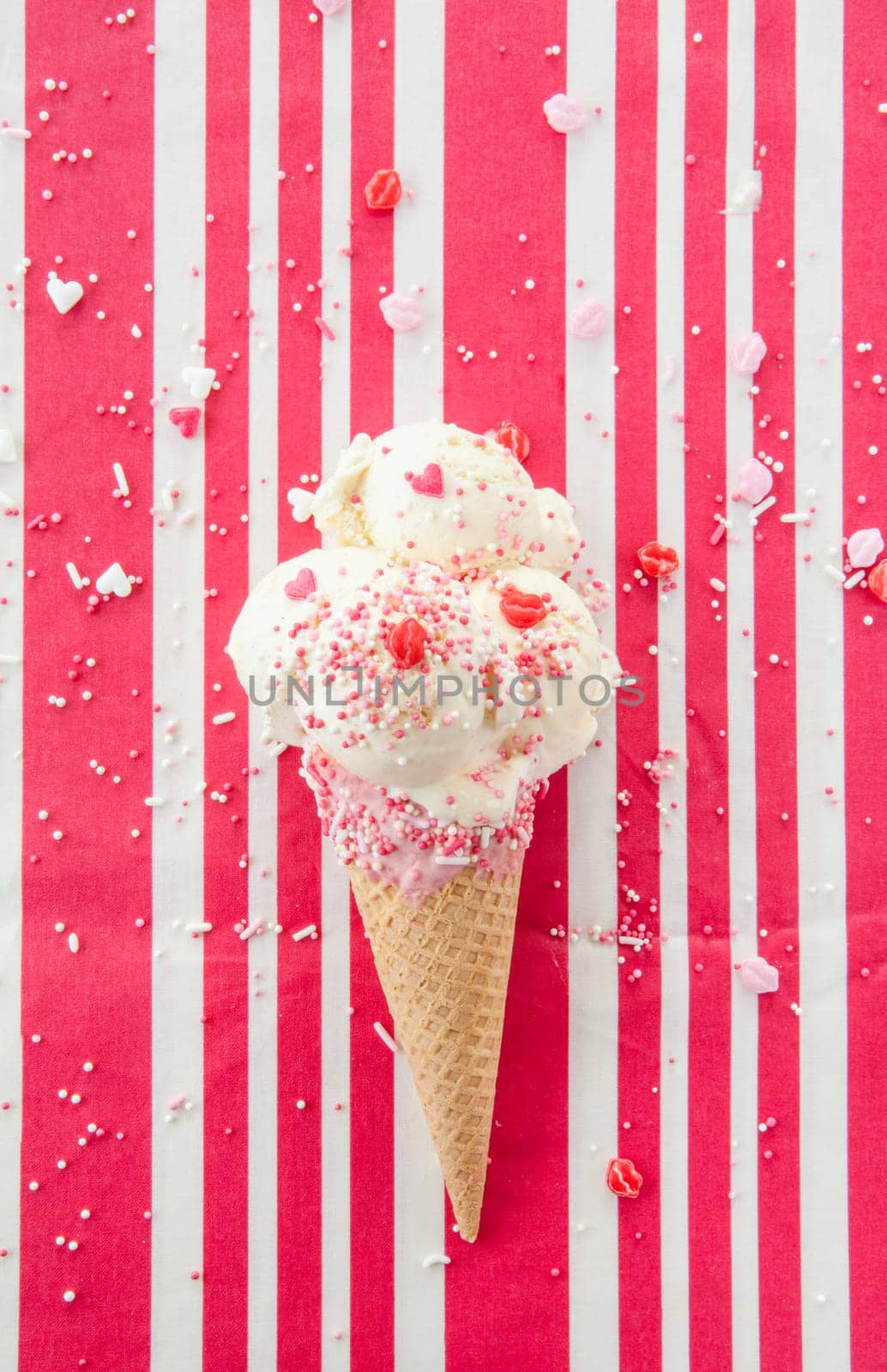 Vanilla ice cream in waffle tug with sugar sprinkles