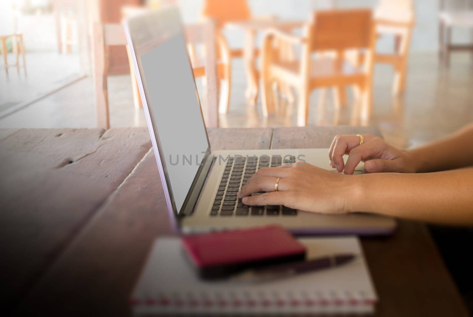 Mobile items on wooden work table, stock photo