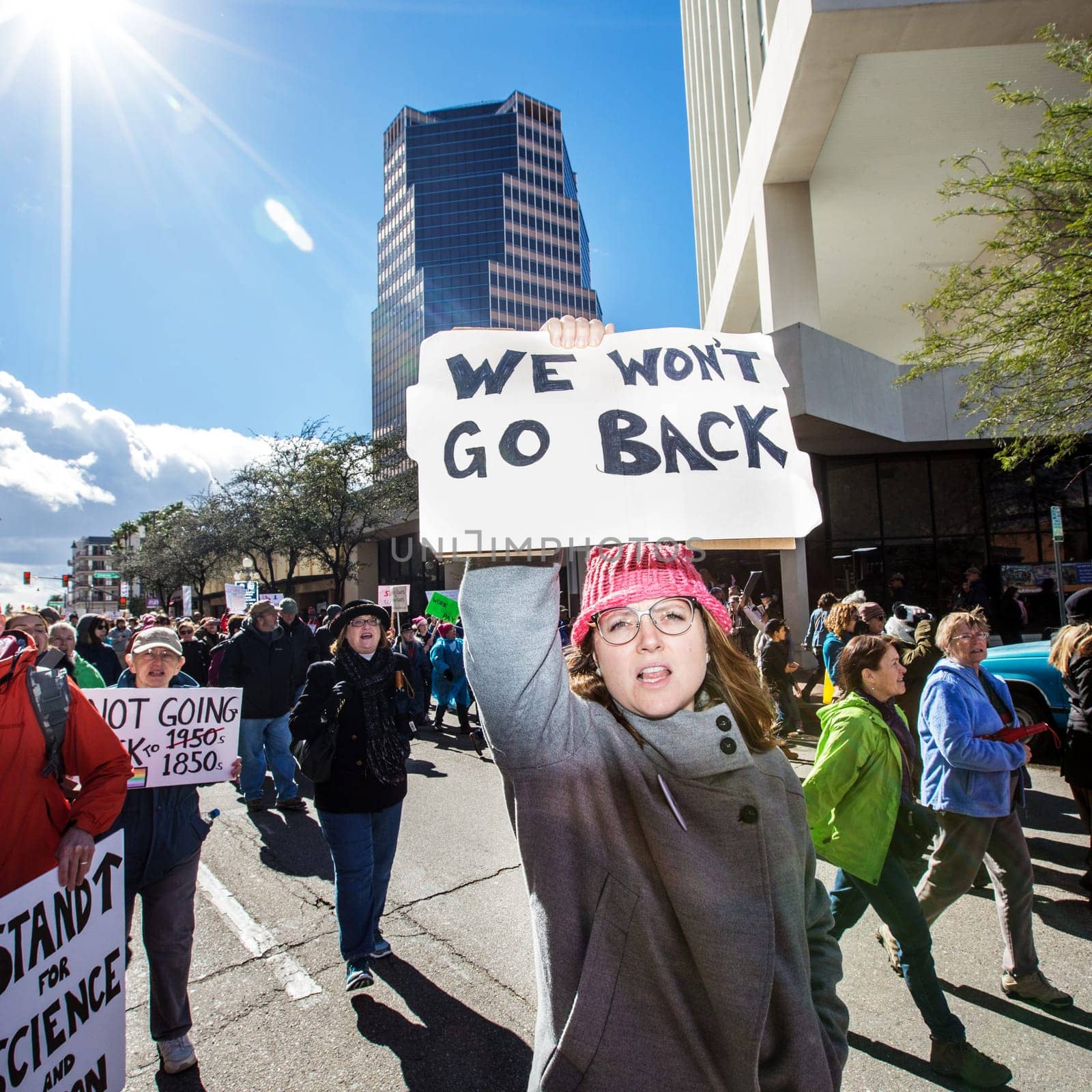 TUCSON, AZ - JANUARY 21: Woman holding immigrant rights sign during the Women's March on Washington protest against Donald Trump on January 21, 2017 in Tucson, AZ, USA..