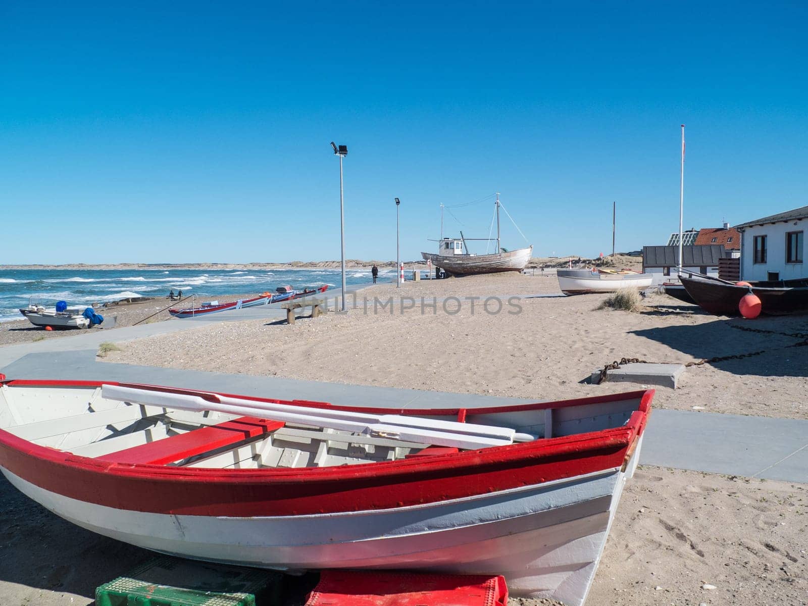 Fishing village with the old wooden fishing boats pulled up on the beach