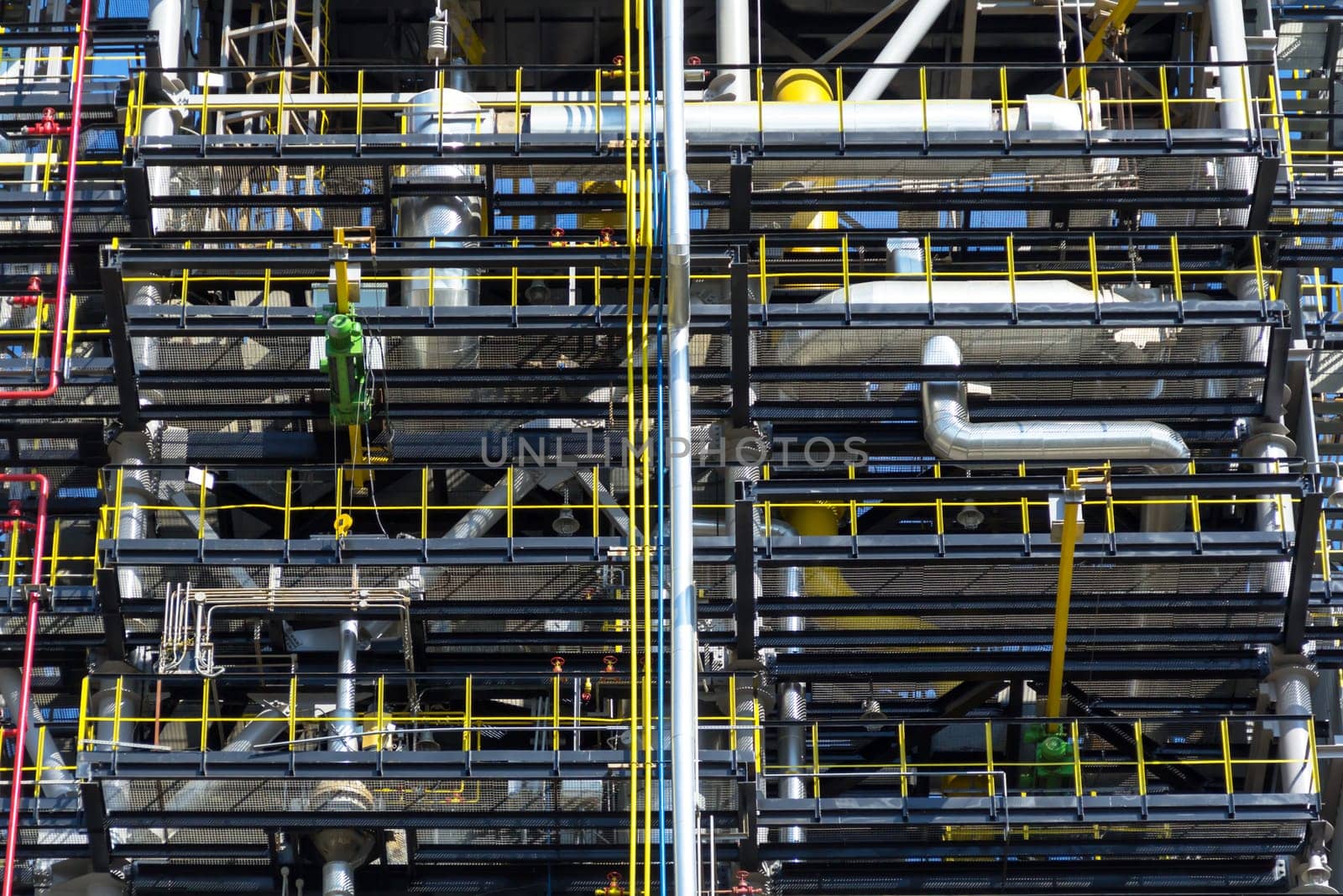 The photo of the pipeline of the plant processing fuel in summertime
