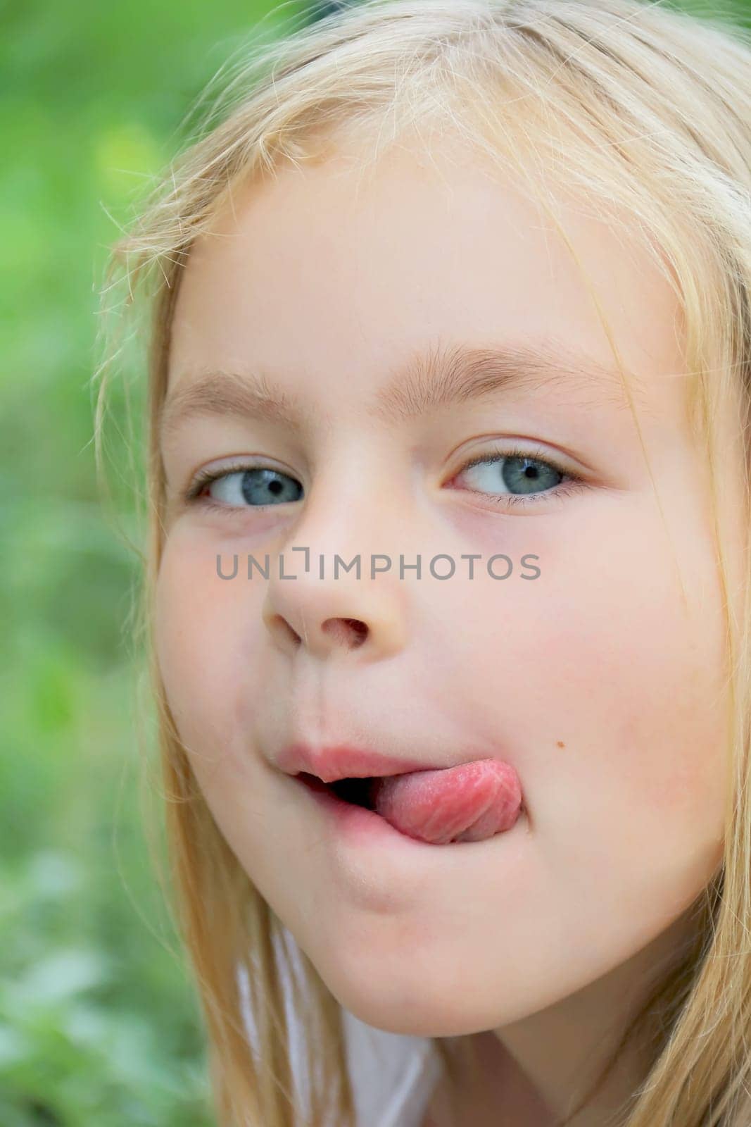 Portrait of girl with smile and makes faces
