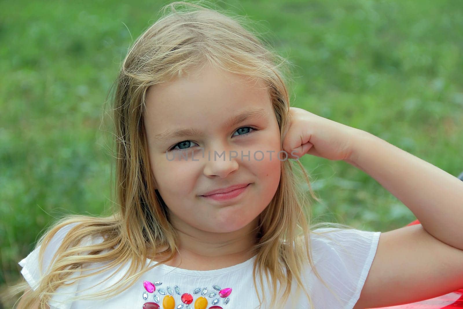 Portrait of girl with blond hair and blue eyes