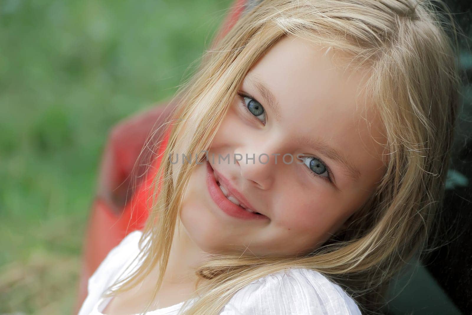 Portrait of smiling girl with blue eyes
