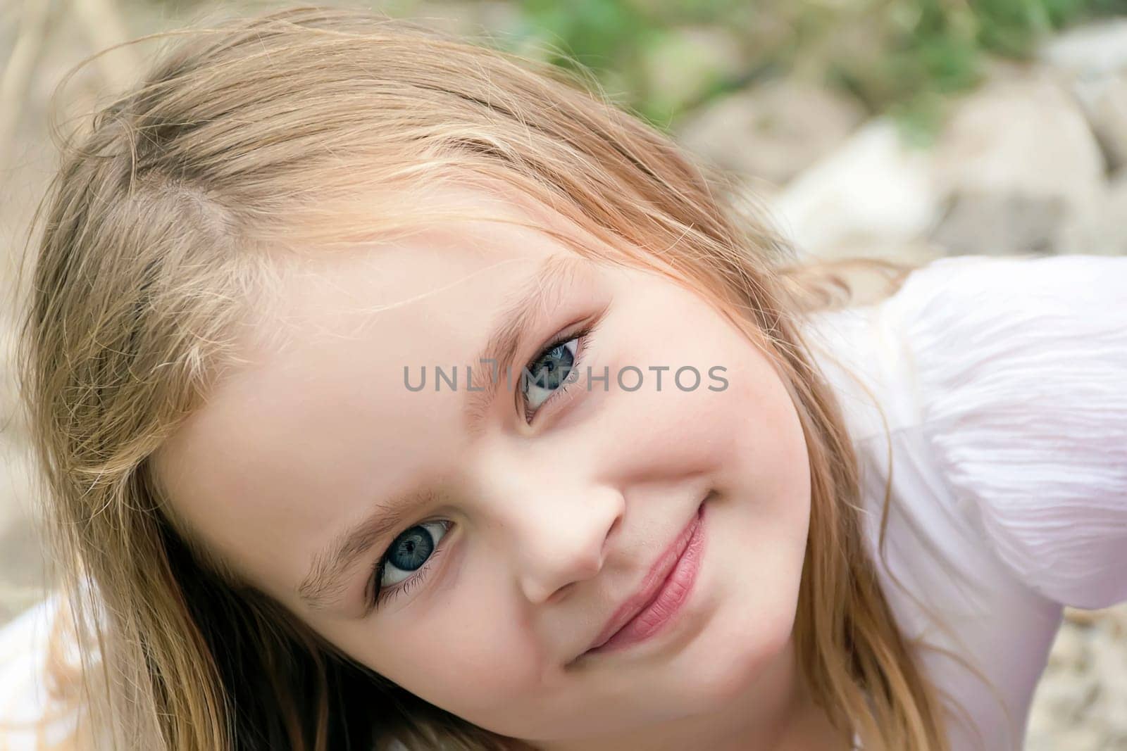 Portrait of cute girl with blond hair