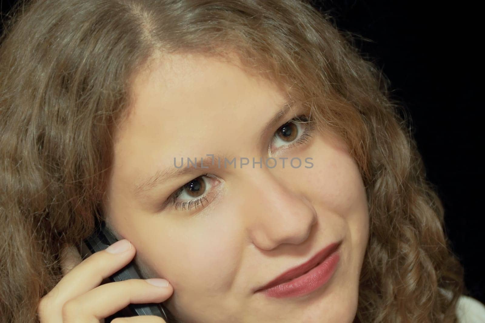 Portrait of young woman with long brown nature hair