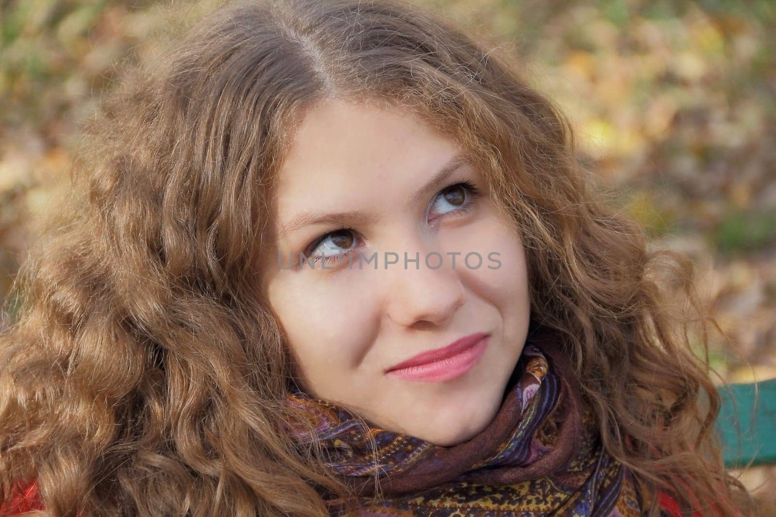 Portrait of thinking young woman with long hair