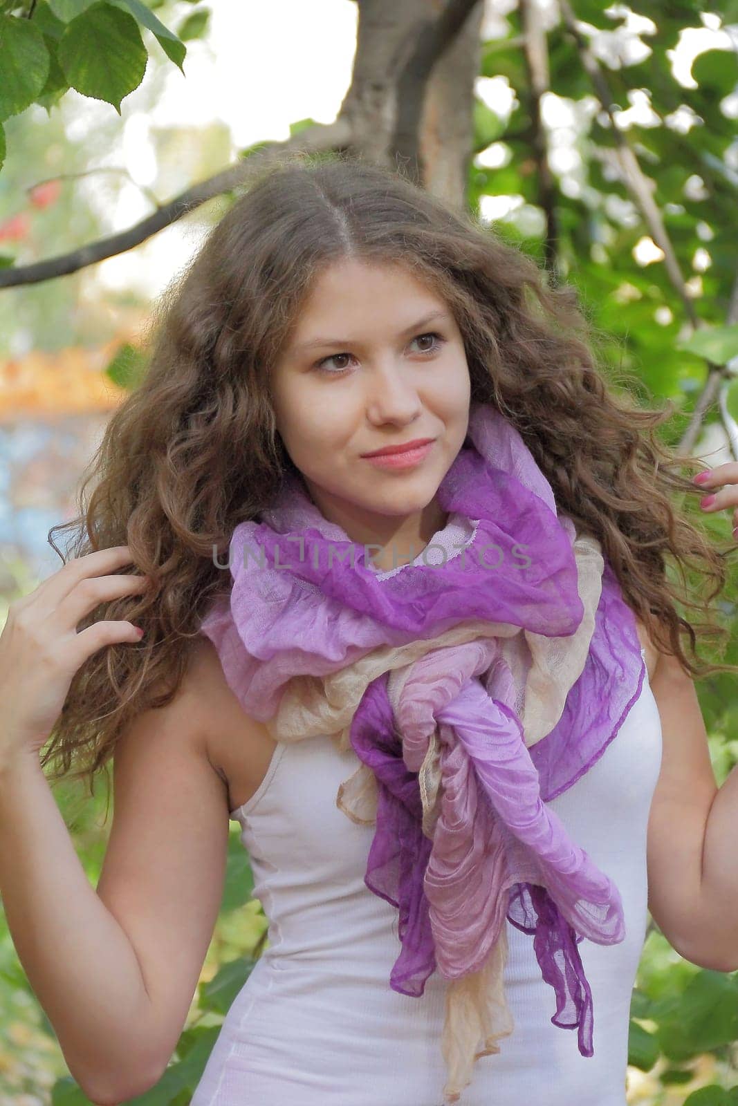 Portrait of woman with violet scarf in summer time