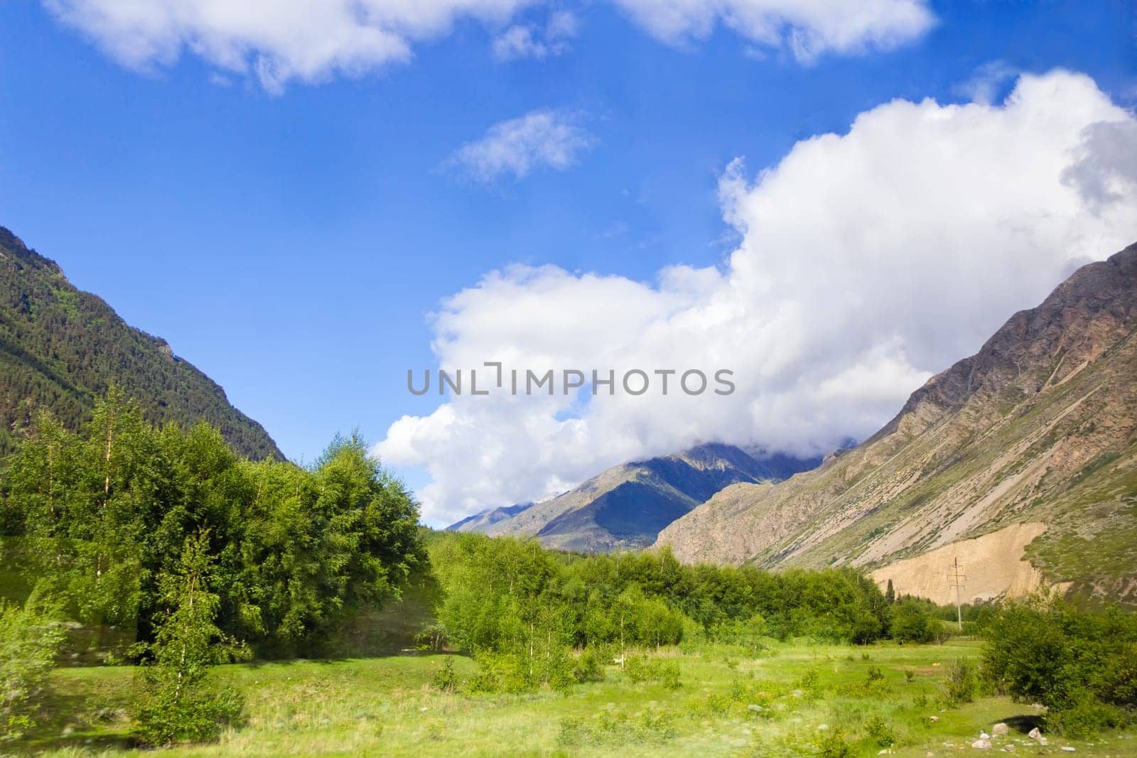 Summer landscape with Russian Caucasus green mountains