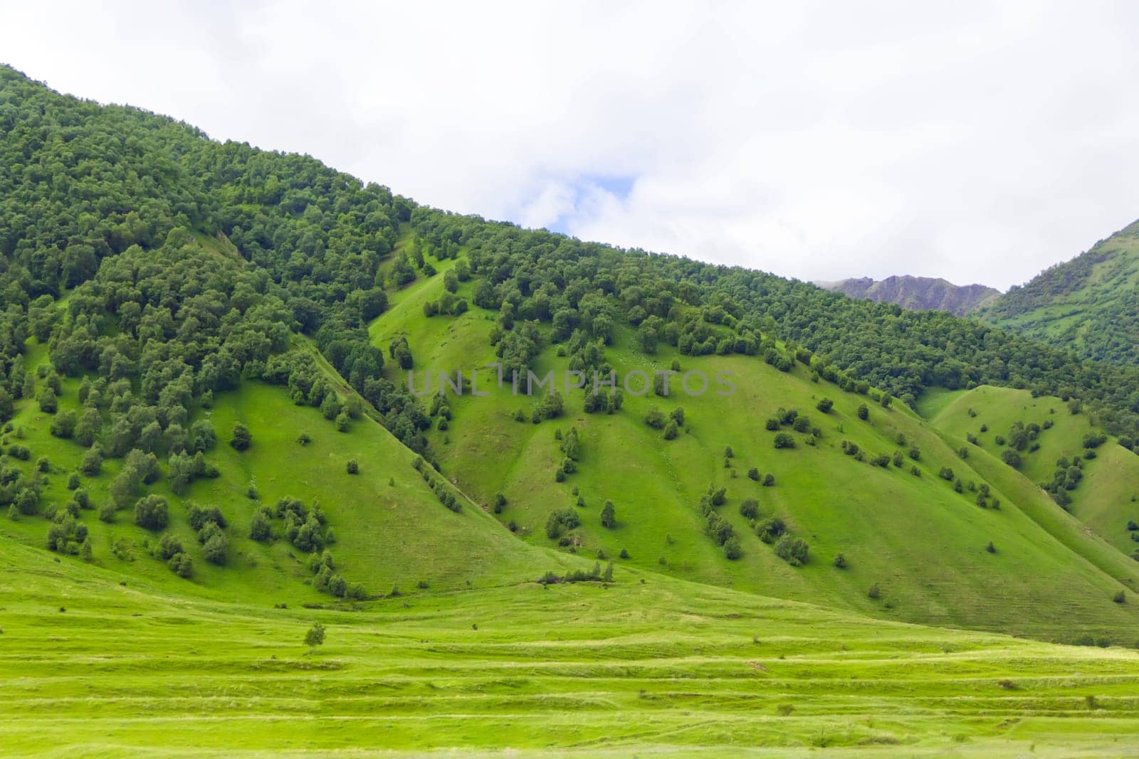 Summer landscape with Russian Caucasus green mountains