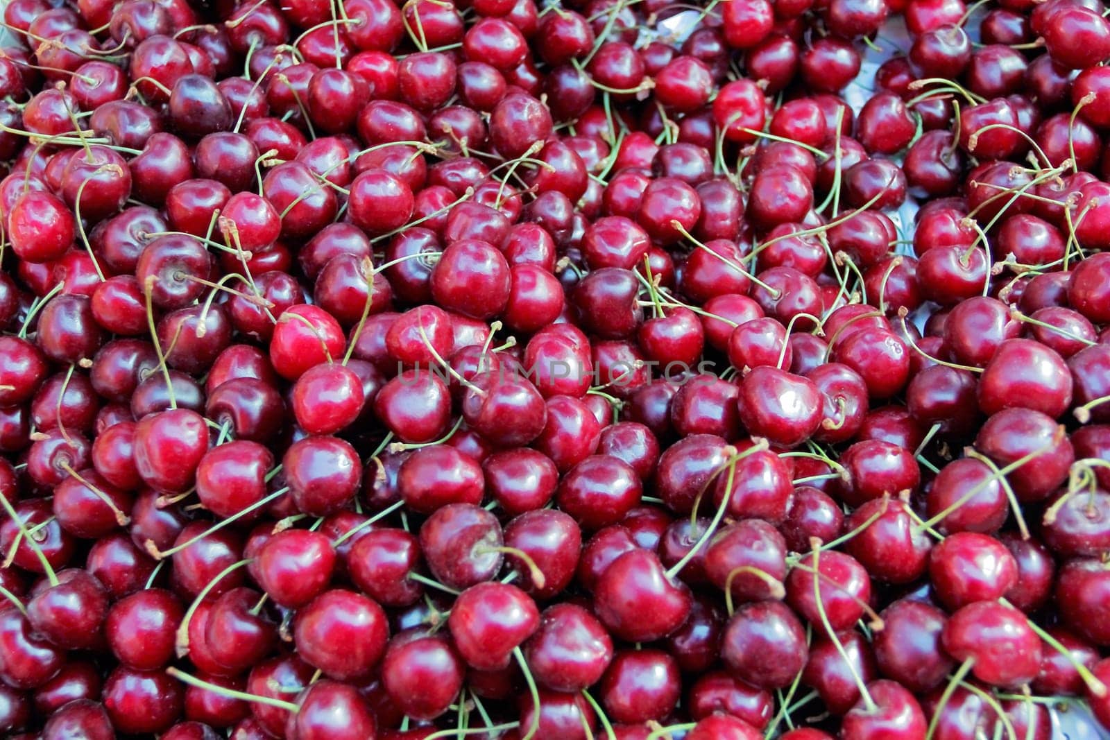 Image of background fresh dark red cherry