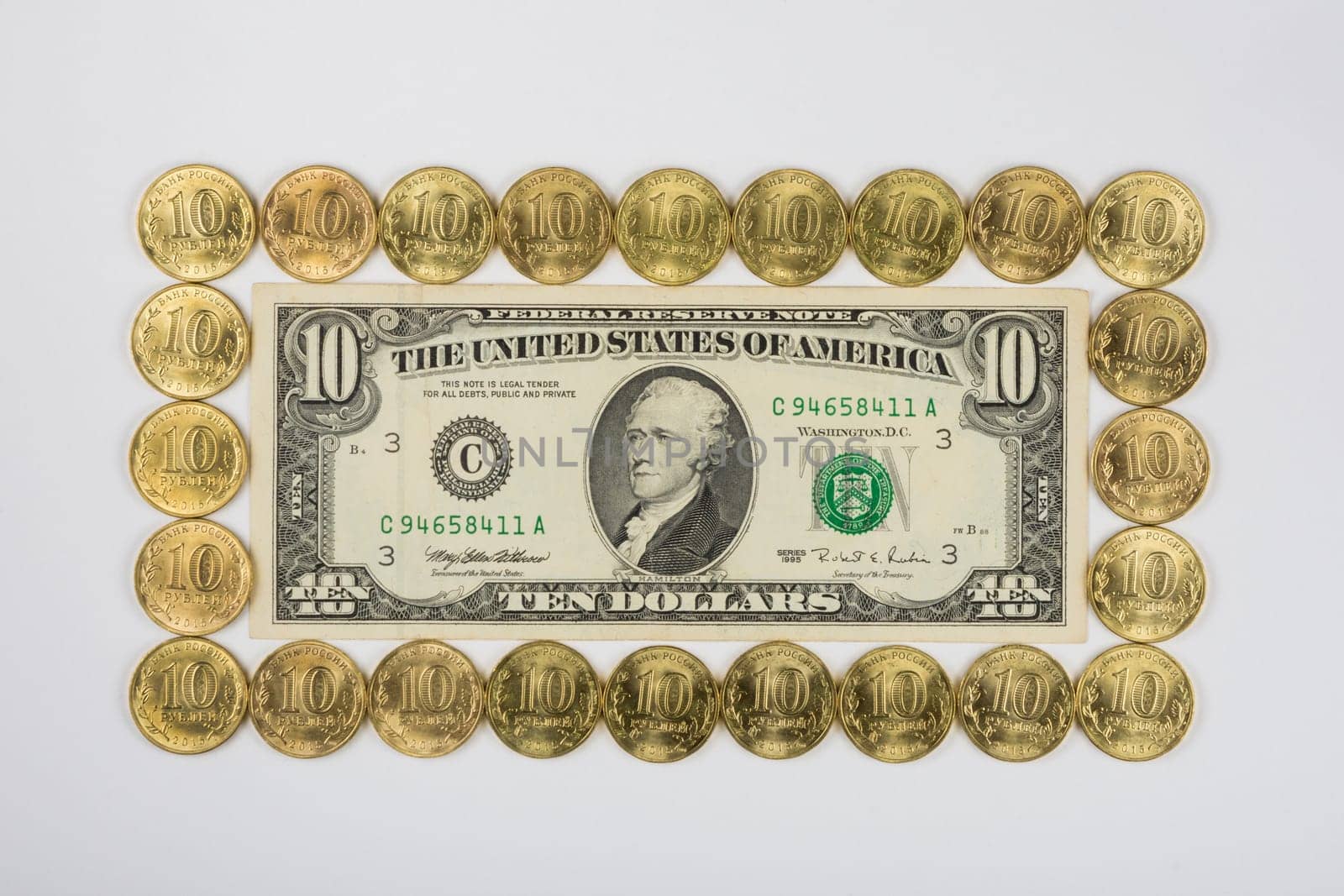Ten dollars levied on the perimeter of a ten Russian coins, top view